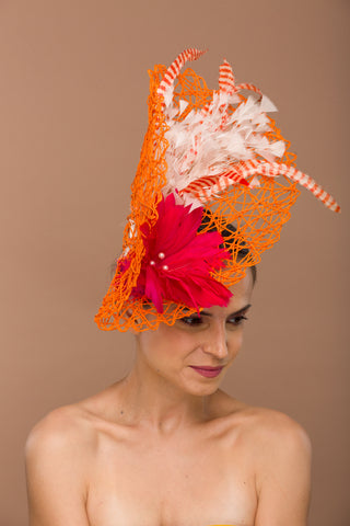 Calytrix-orange paper woven fascinator base with red feather flower and multi colored feathers
