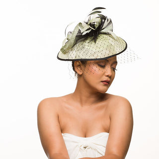 Pale green fascinator with veil