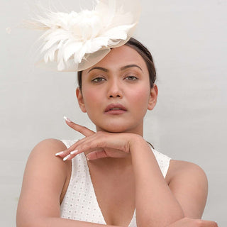 Beige fascinator with white feather flower
