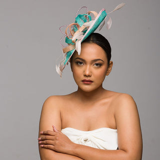 Dual tone sea green and pink fascinator with twirls