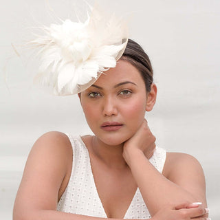 Beige fascinator with white feather flower