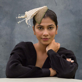 Green fascinator with lilies